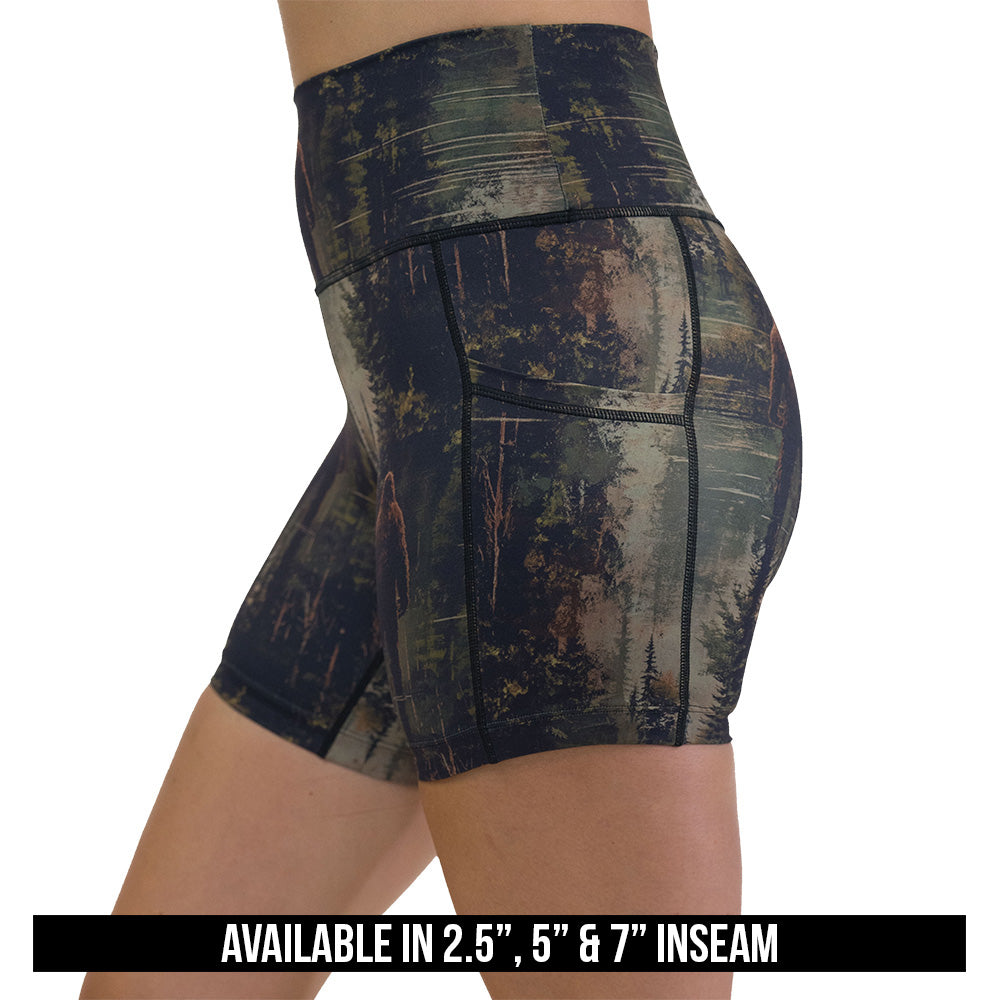 shorts with a forest design and a bigfoot graphic on it available inseams