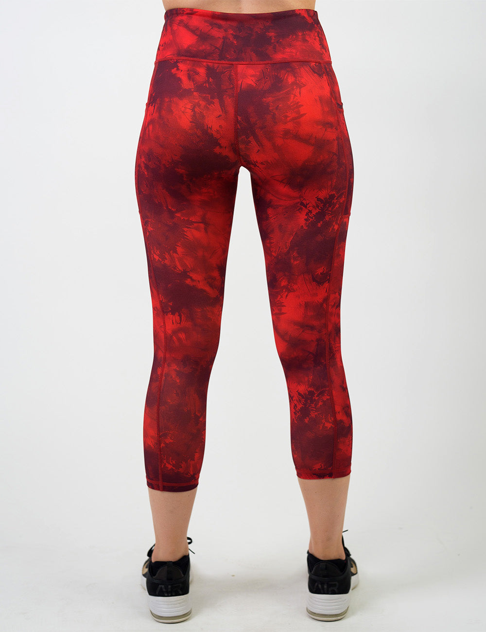 back of the dark red tie dye capri leggings against a white background