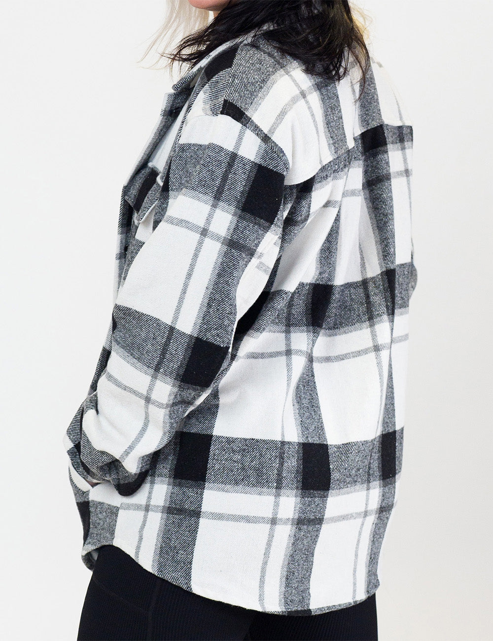 back of the black plaid shacket against a white background