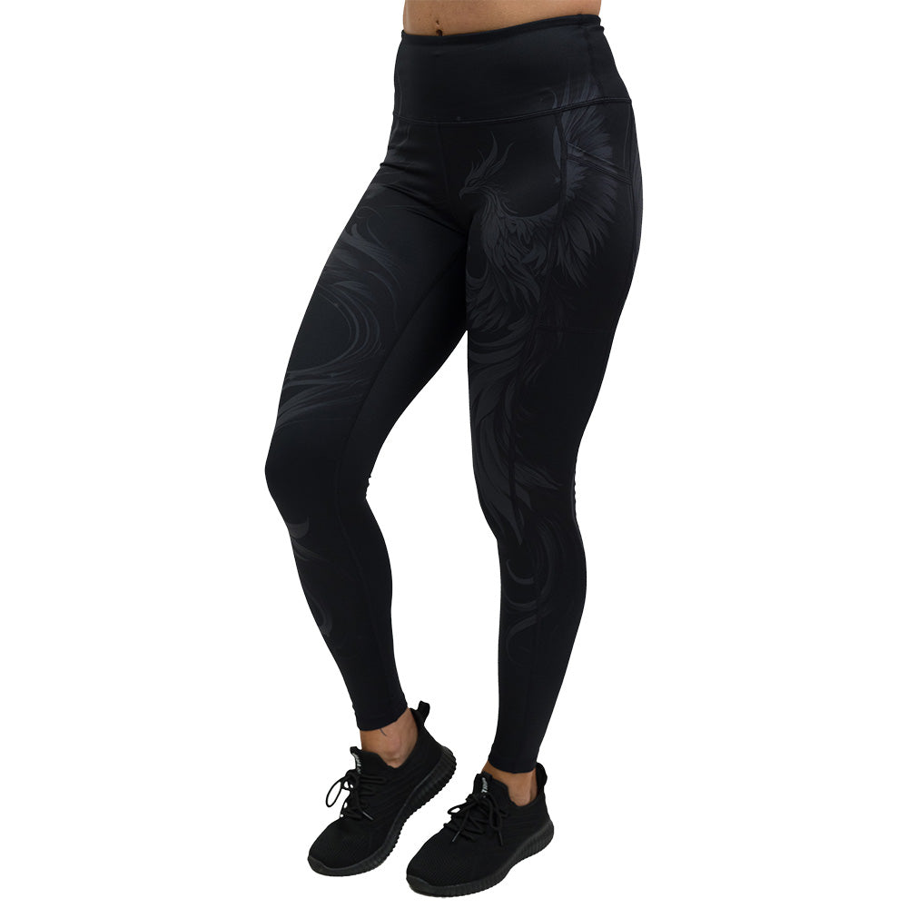 Black leggings with a phoenix design on them