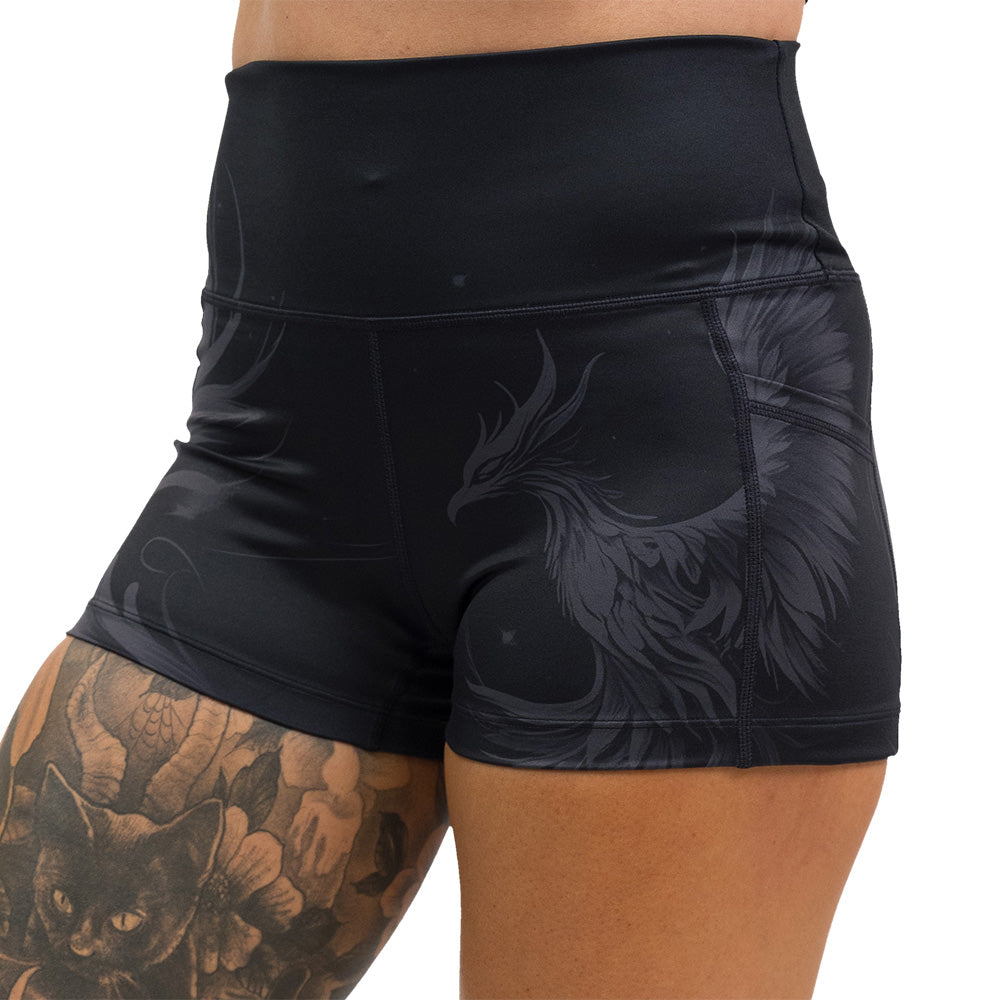 Black shorts with a phoenix design on them