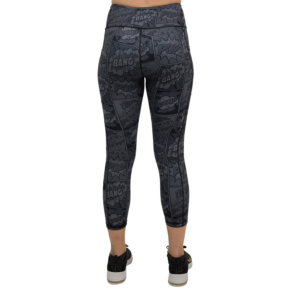 back of black and grey comic book print capri leggings
