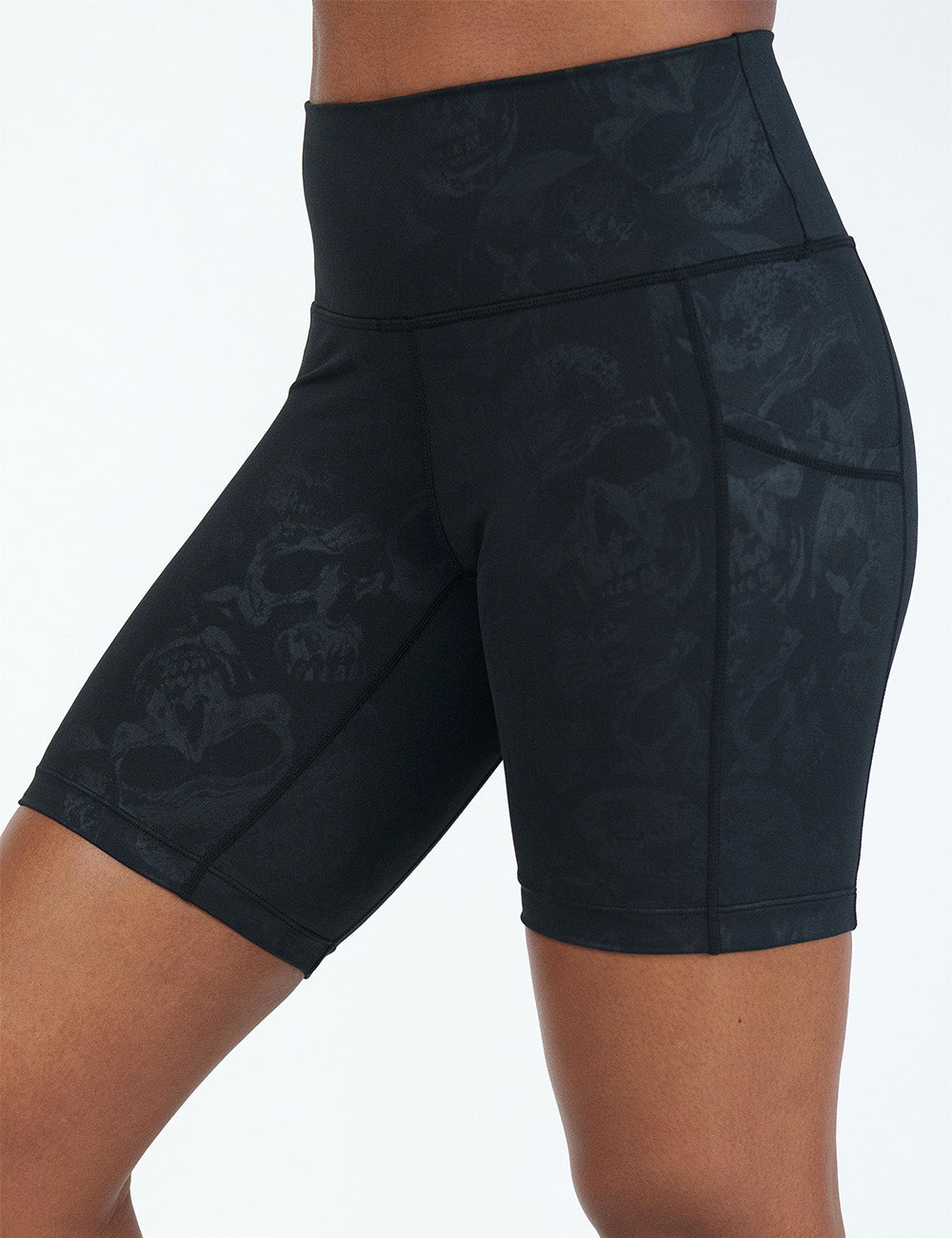 front of the 7 inch black shorts with a dark grey skull pattern against a white background