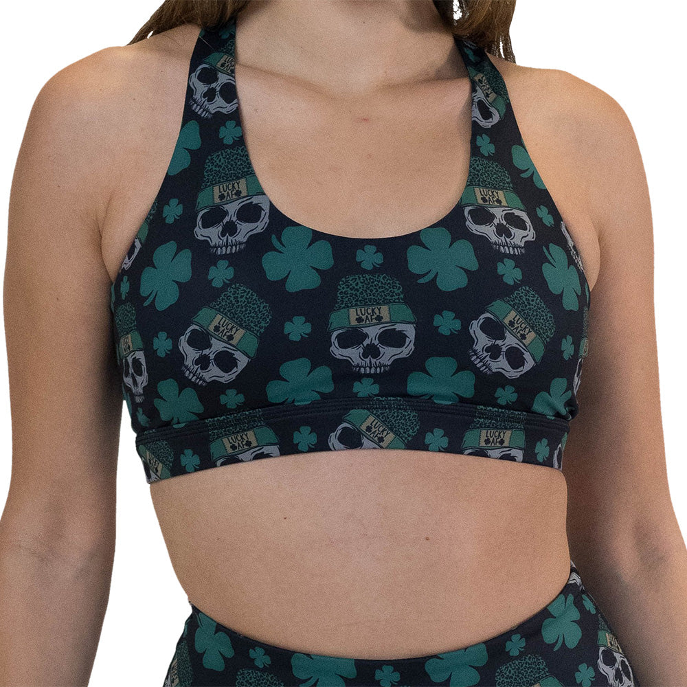 front of the skull and shamrock print sports bra