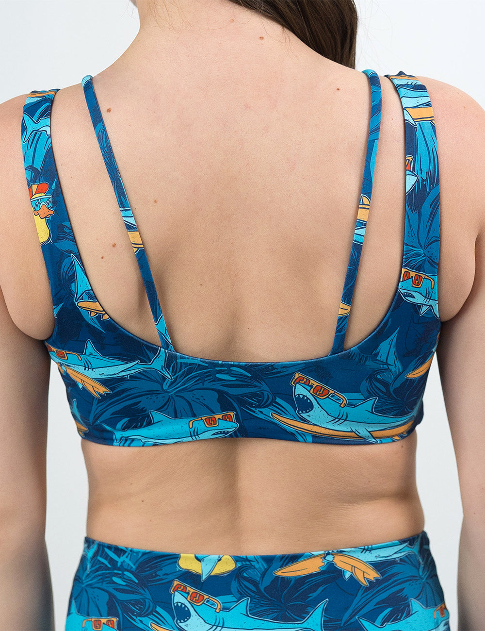 back of the cartoon sharks surfboarding with sunglasses vista bra