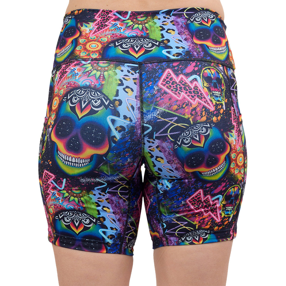 back of the 7 inch the brightly colored psychedelic skulls pattern against a busy background full of designs shorts against a white background