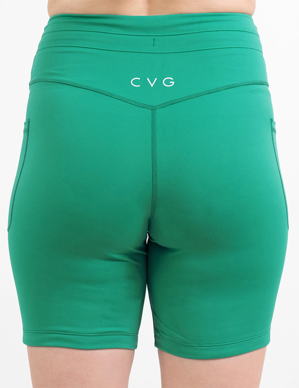 back of the 7 inch green omni style shorts against a white background