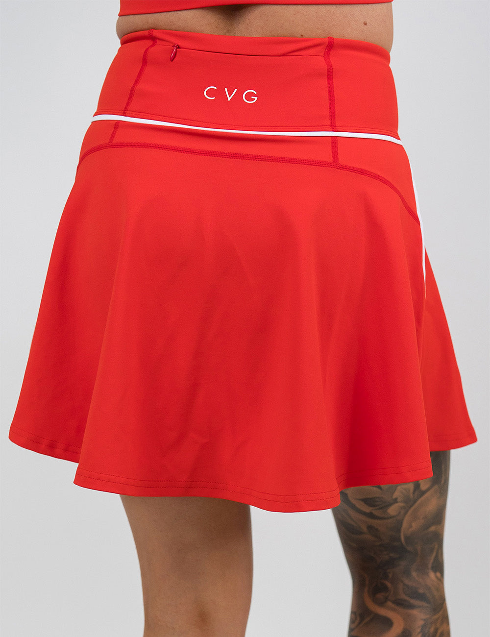back of the longer length red skirt with white accents against a white background