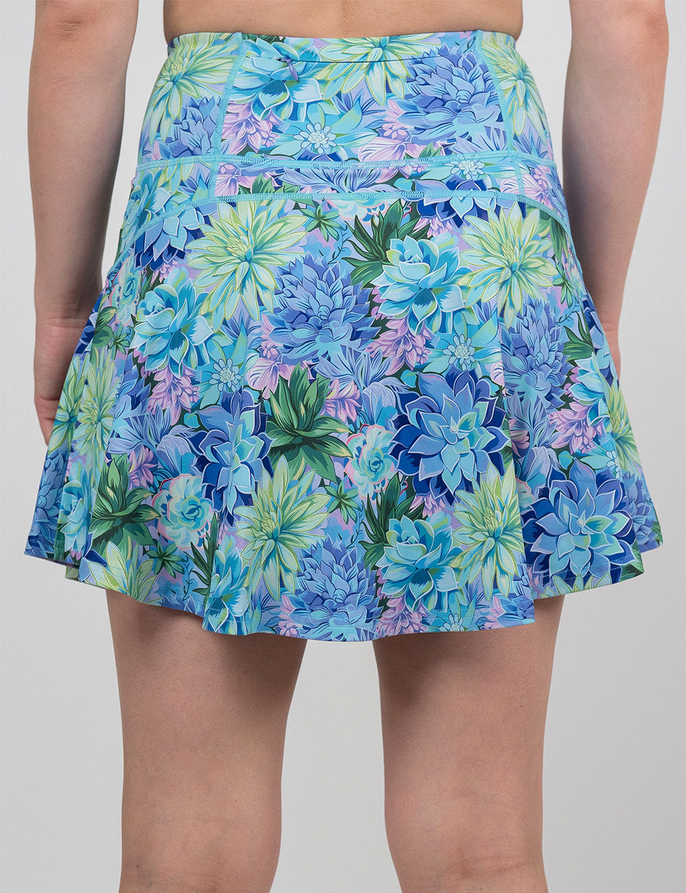 back of the longer length blue flowers skirt against a white background