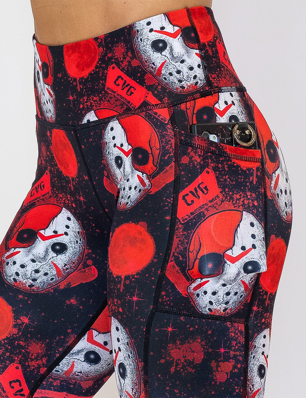 close up of the bloody hocky mask leggings with a phone in its pocket