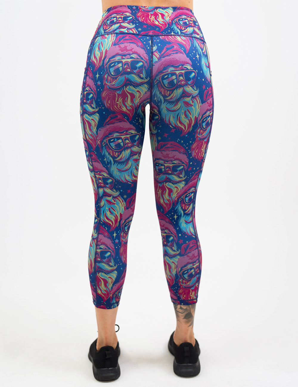 back of the colorful Santa-in-sunglasses capri leggings against a white background