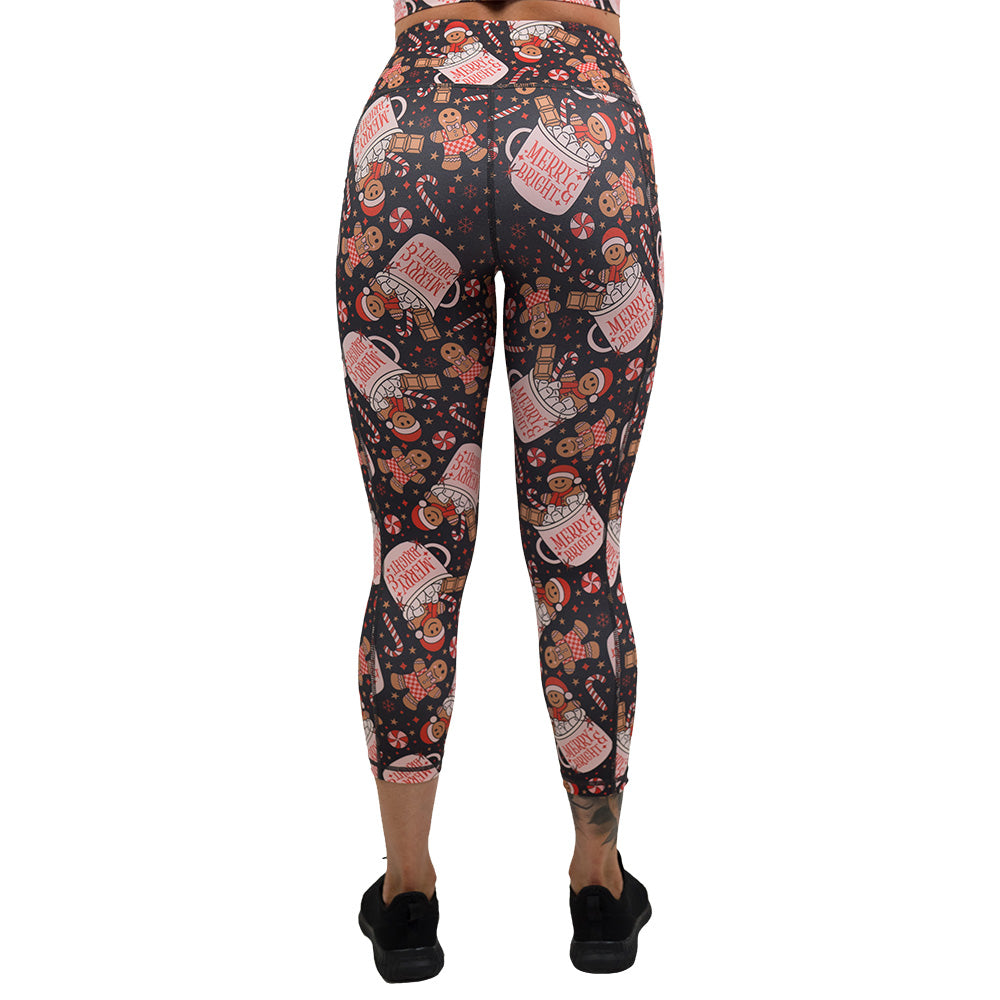 back of the Christmas-themed leggings with gingerbread men and candy canes