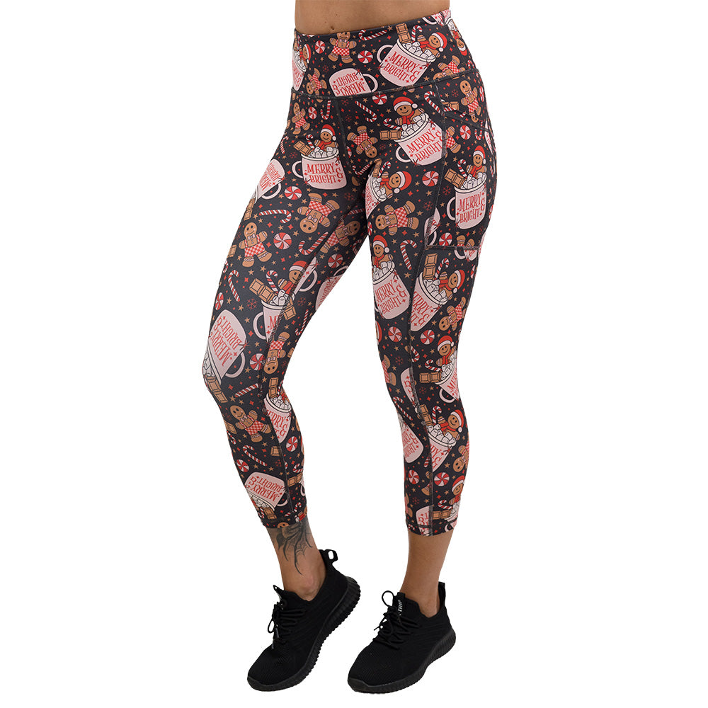 Christmas-themed leggings with gingerbread men and candy canes