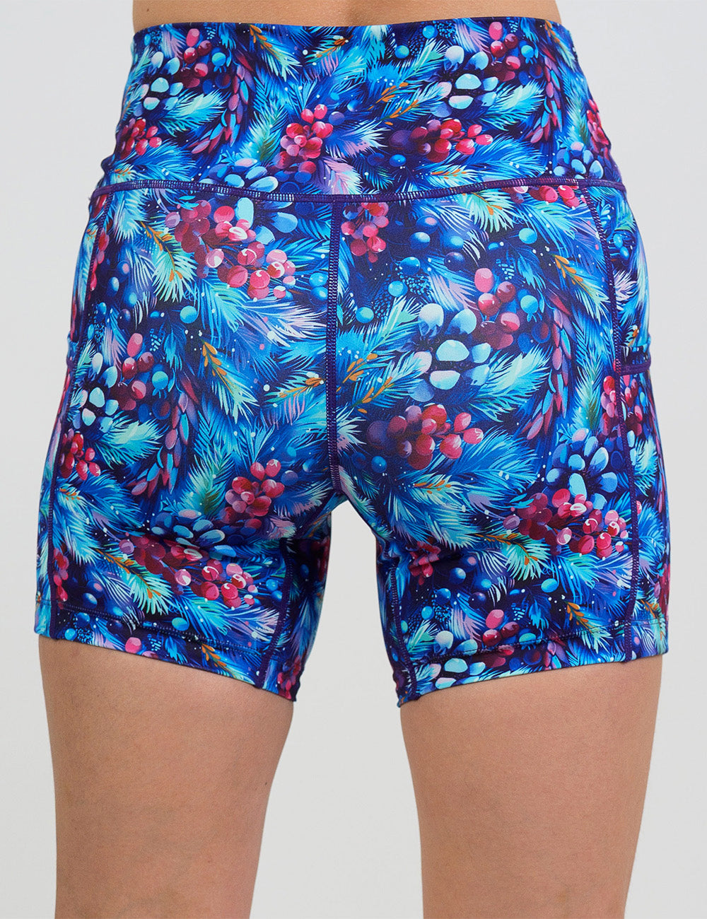 back of the 5 inch winter berries among blue leaves shorts against a white background