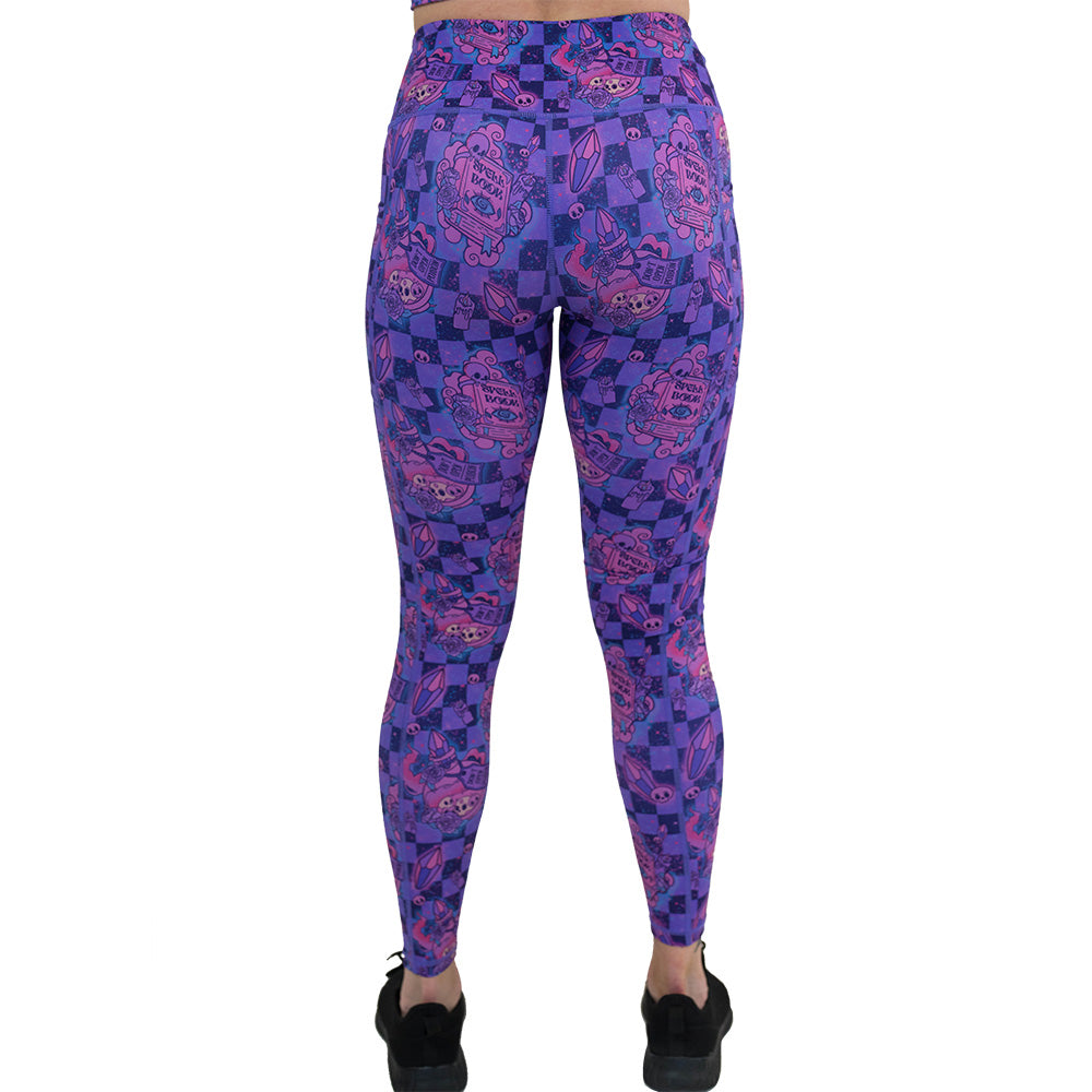 back of the spellbook patterned leggings
