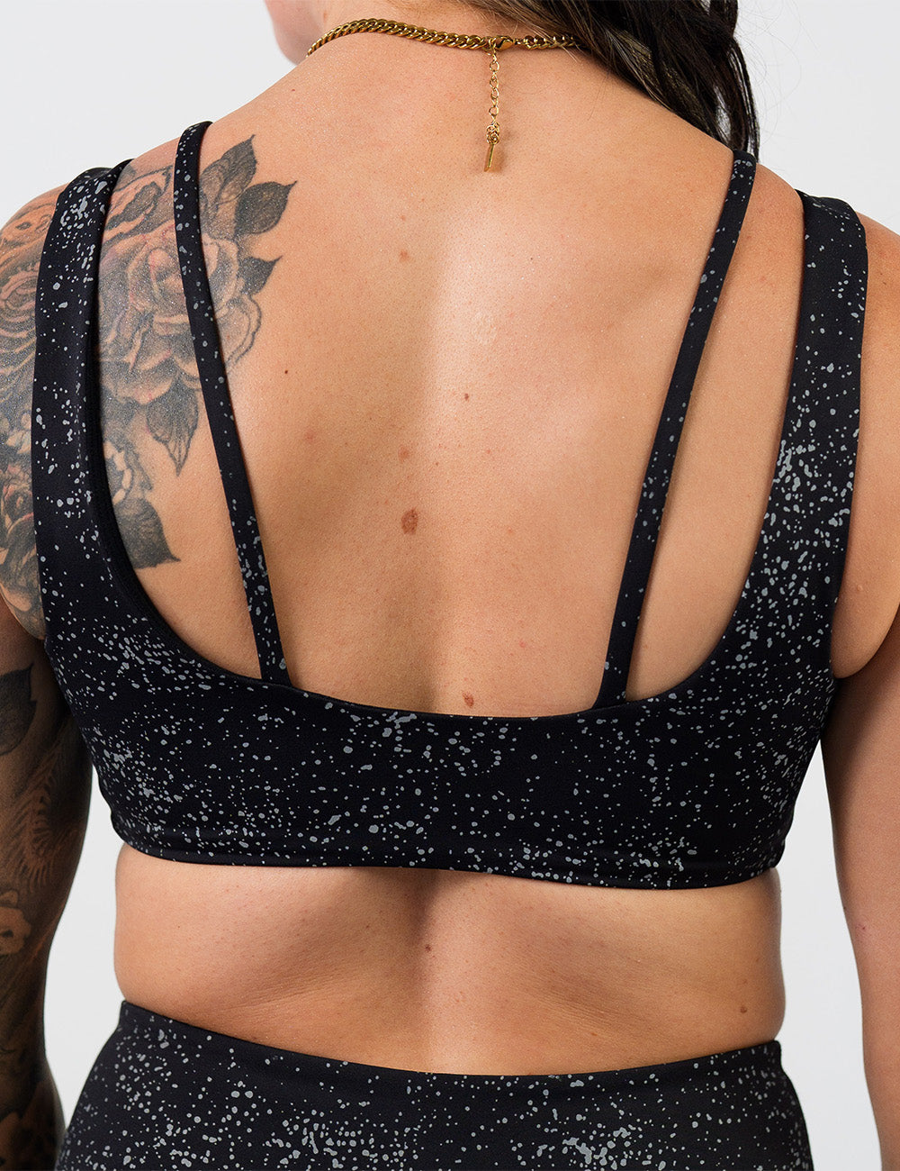 back of the black bra with reflective spots