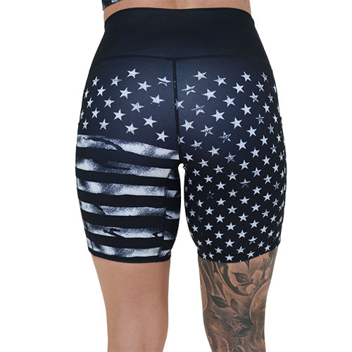 back of the 7 inch black shorts with white American flag design on it