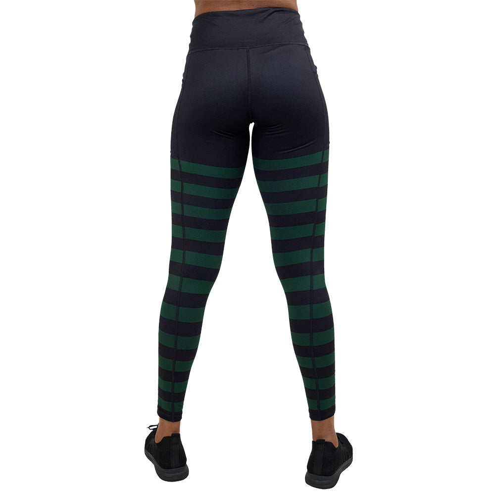 back of the full length green stripe against a dark background leggings against a white background