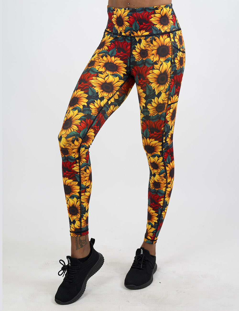 front of the sunflower with red flowers full length leggings against a white background