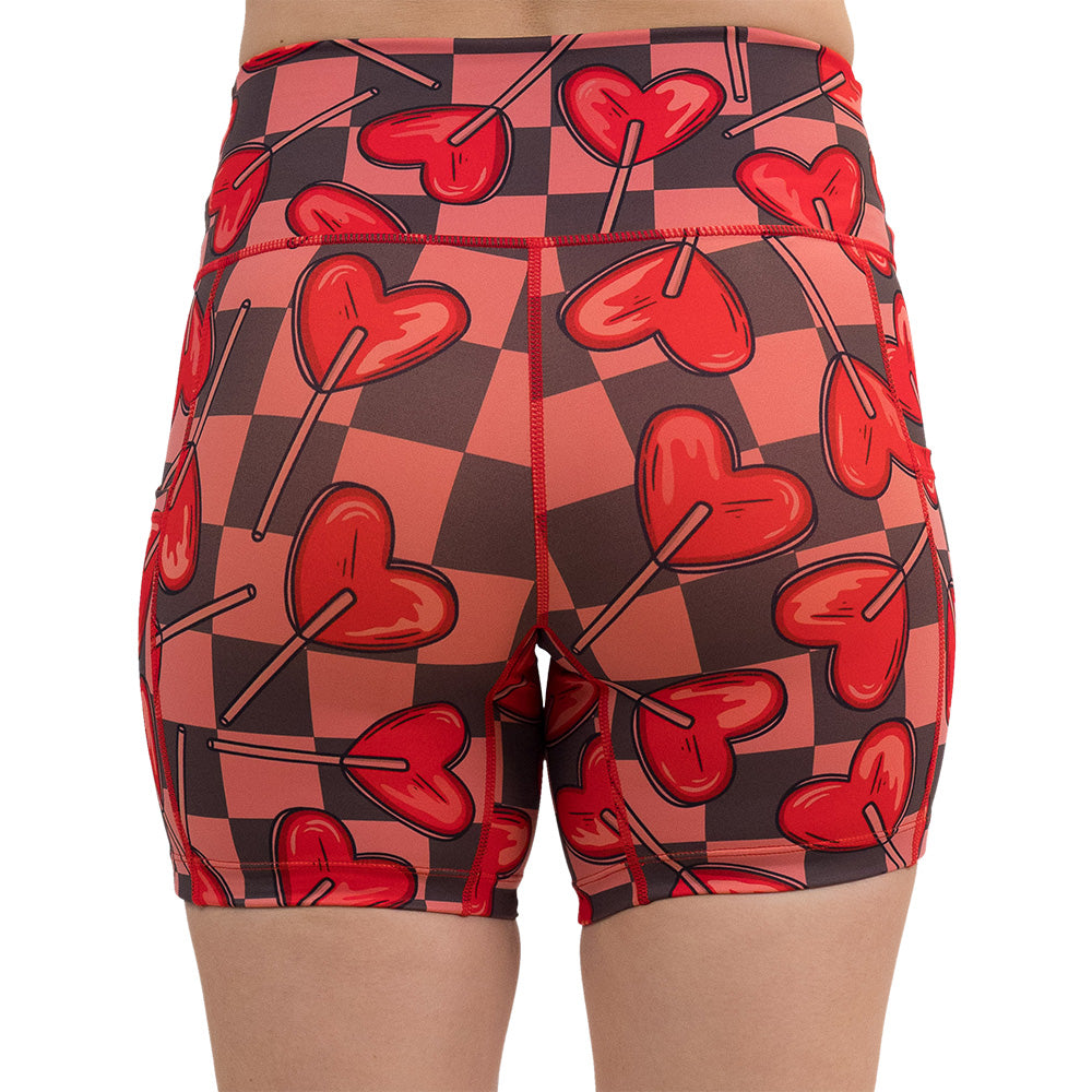 back of the 5 inch heart lollypops on a checker board pattern shorts against a white background
