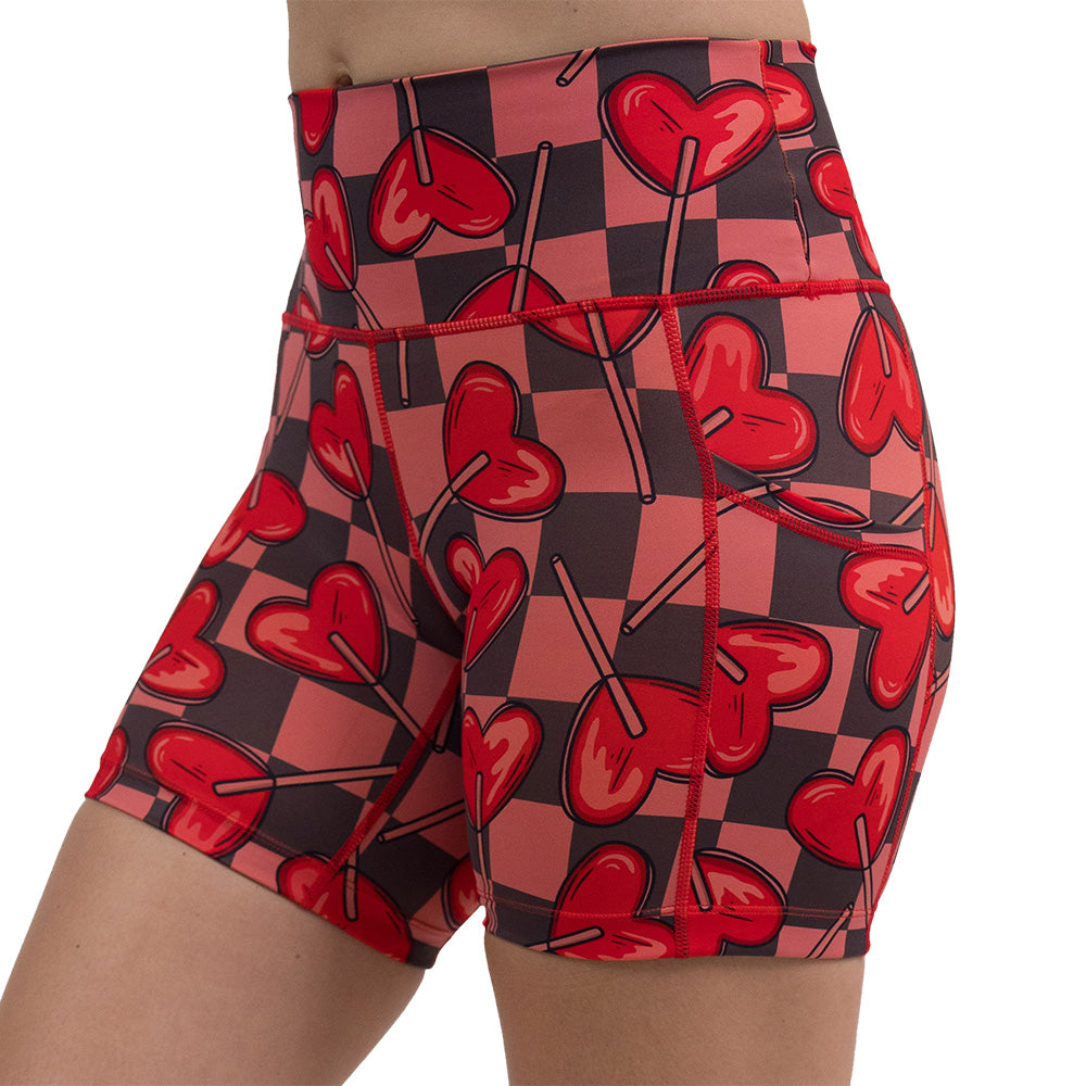 5 inch heart lollypops on a checker board pattern shorts facing the front against a white background