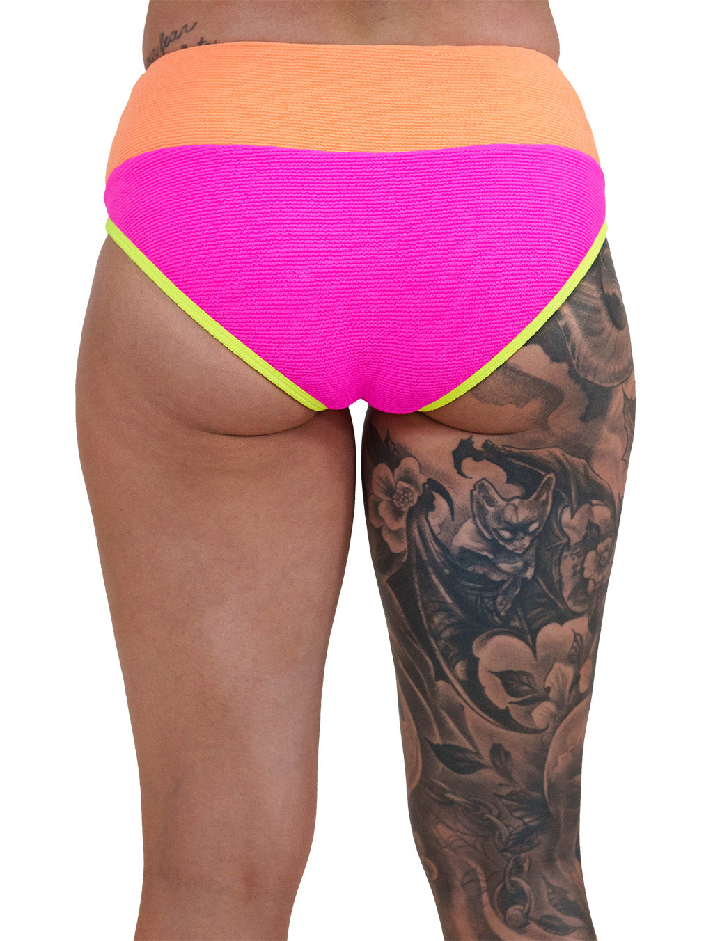 back of the model wearing the pink, orange and yellow bathing suit bottoms