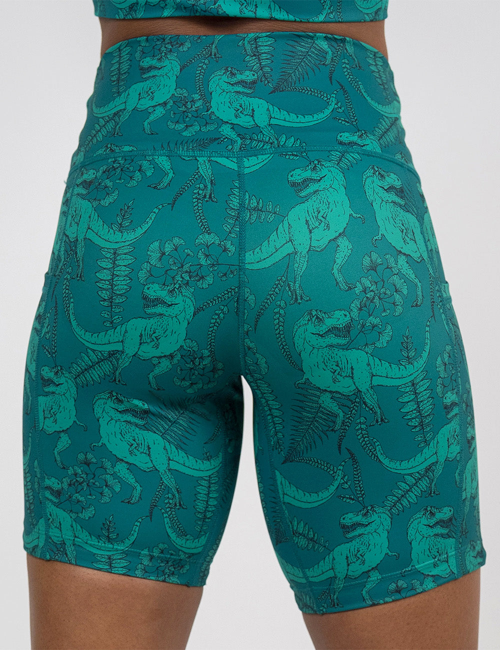 back of the 7 inch teal t-rex shorts against a white background