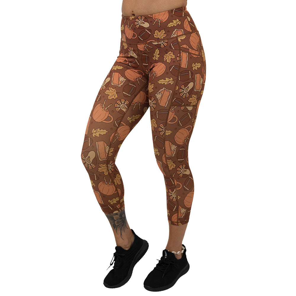 leggings with pumpkins, leaves, and football