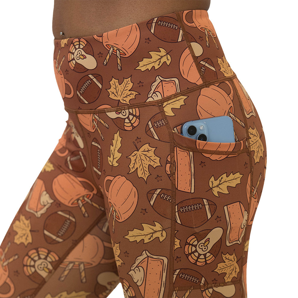 leggings with pumpkins, leaves, and football