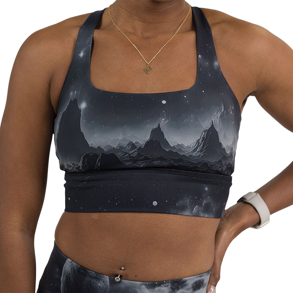 front of the black bra with a mountain and star pattern against a white background