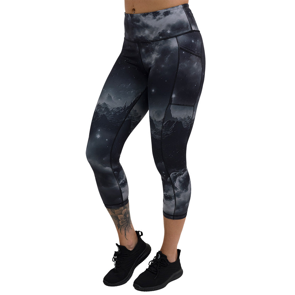 the black leggings with mountain and star pattern facing the front against a white background