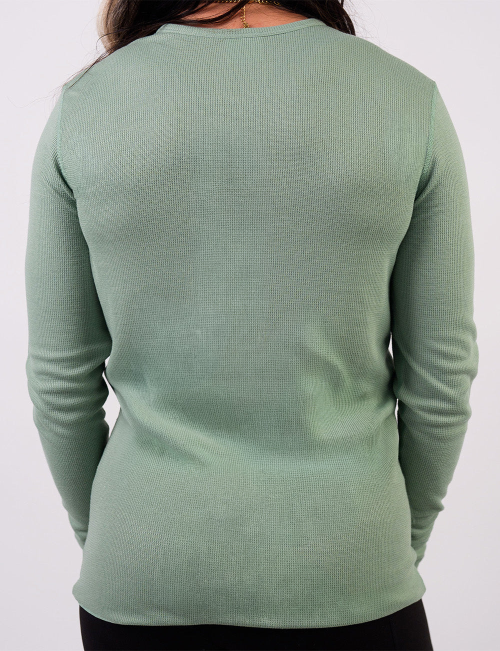 back of the light green thermal against a white background