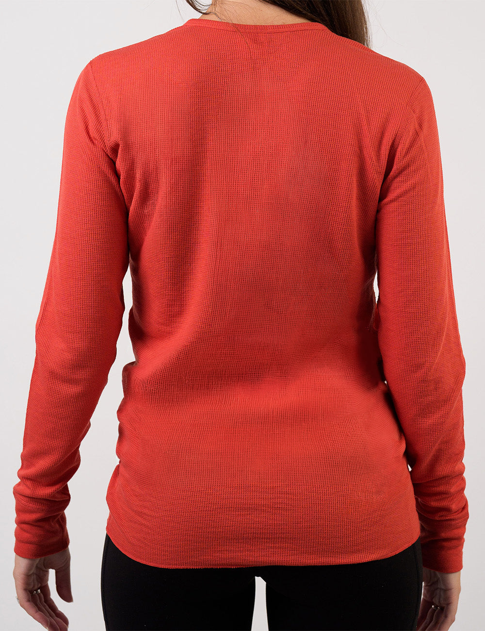 back of the orange thermal against a white background