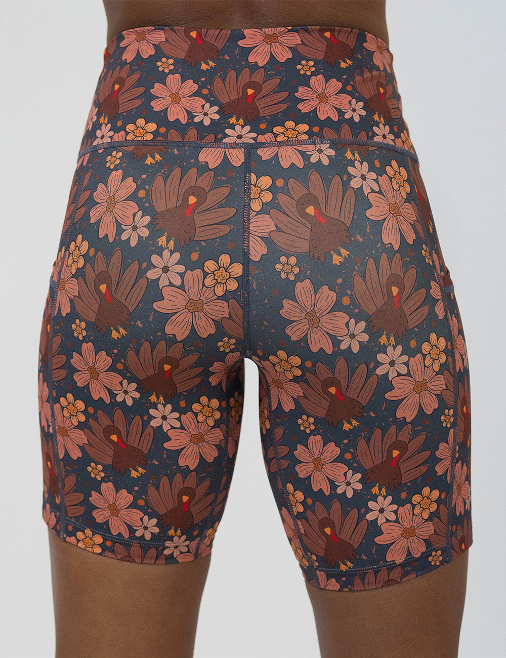 back of the turkeys over a blue background 7 inch shorts against a white background