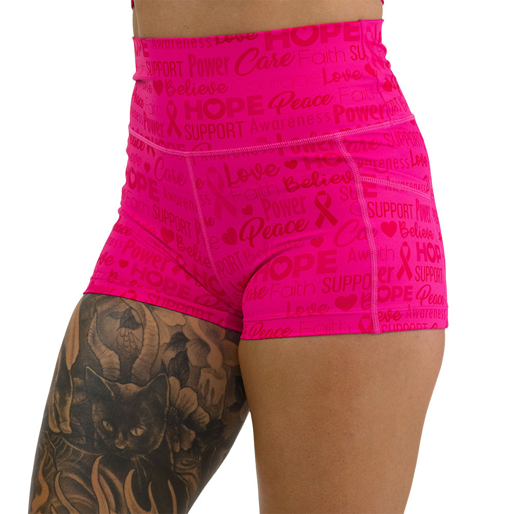 Pink shorts with motivational text and breast cancer awareness ribbons