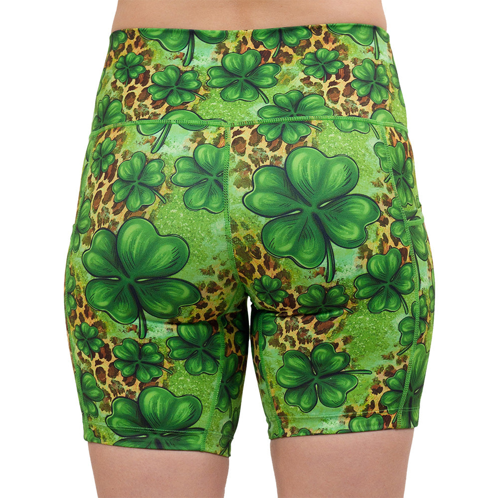back of the 7 inch clover pattern against a cheetah print and green background shorts against a white background