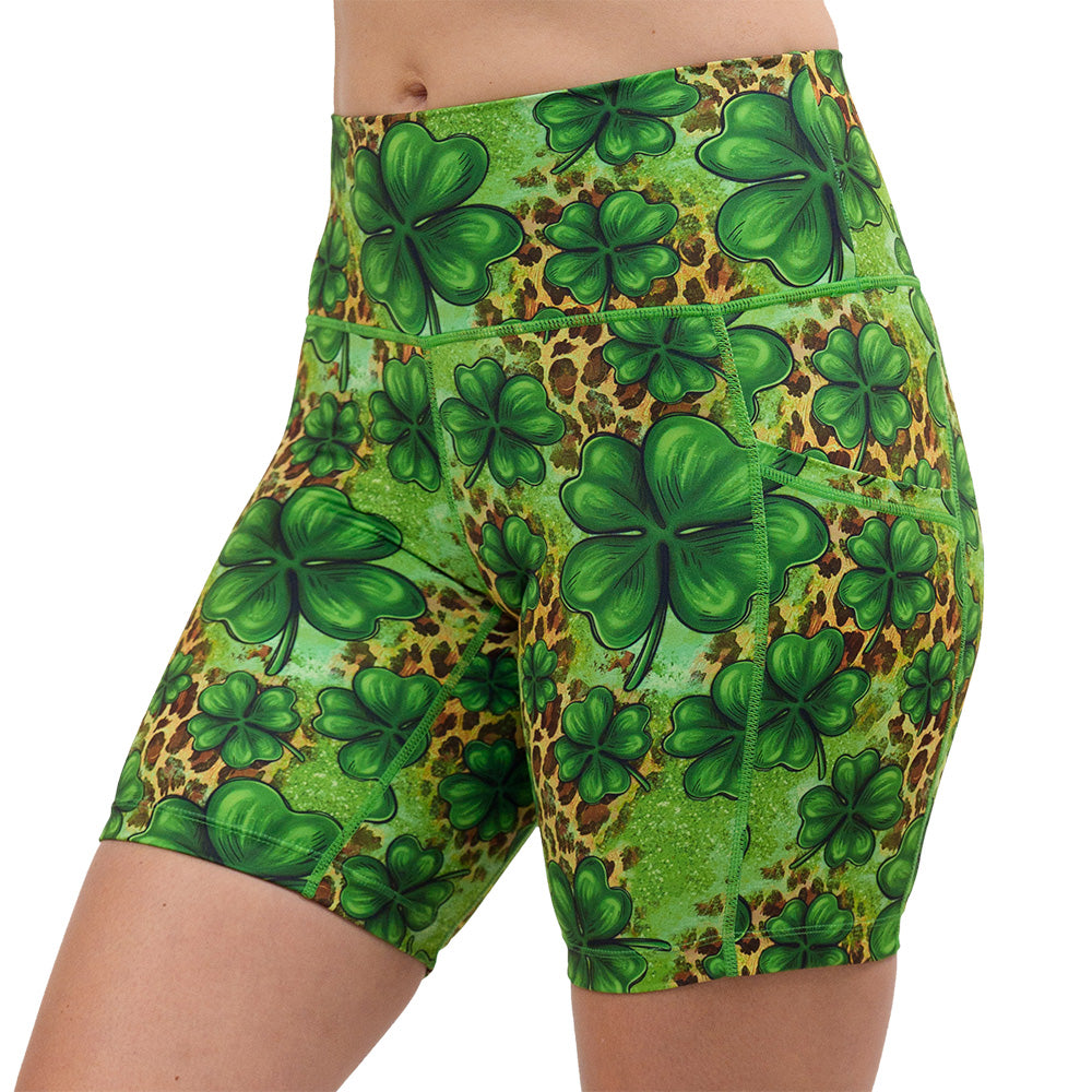 clover pattern against a cheetah print and green background 7 inch shorts against a white background facing the front