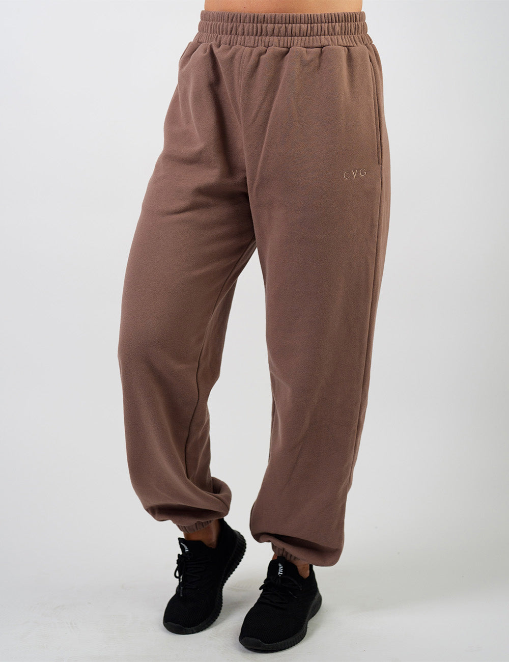 front of the brown sweatpants with a subtle CVG logo