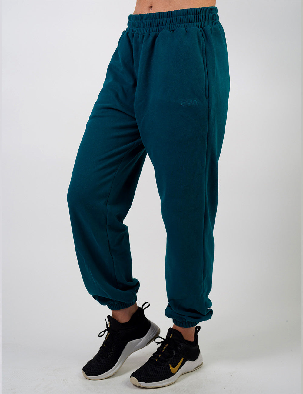 front of the dark blue sweatpants with a subtle CVG logo