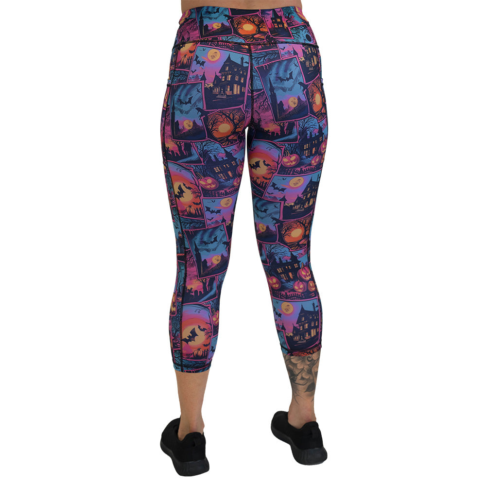 back of the colorful Halloween-themed leggings with pumpkins, ghosts, and bats