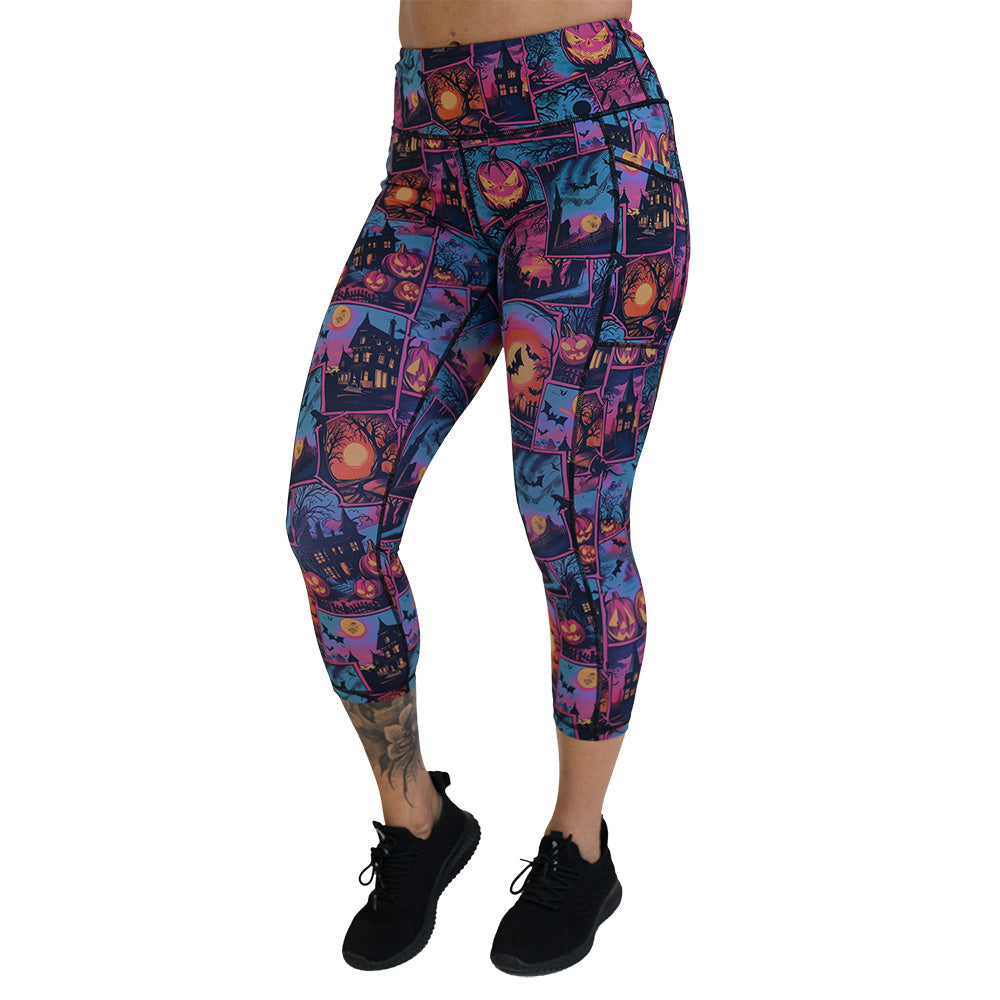 colorful Halloween-themed leggings with pumpkins, ghosts, and bats