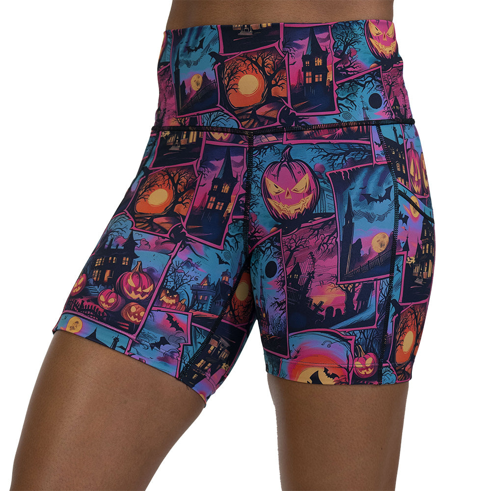 colorful Halloween-themed shorts with pumpkins, ghosts, and bats