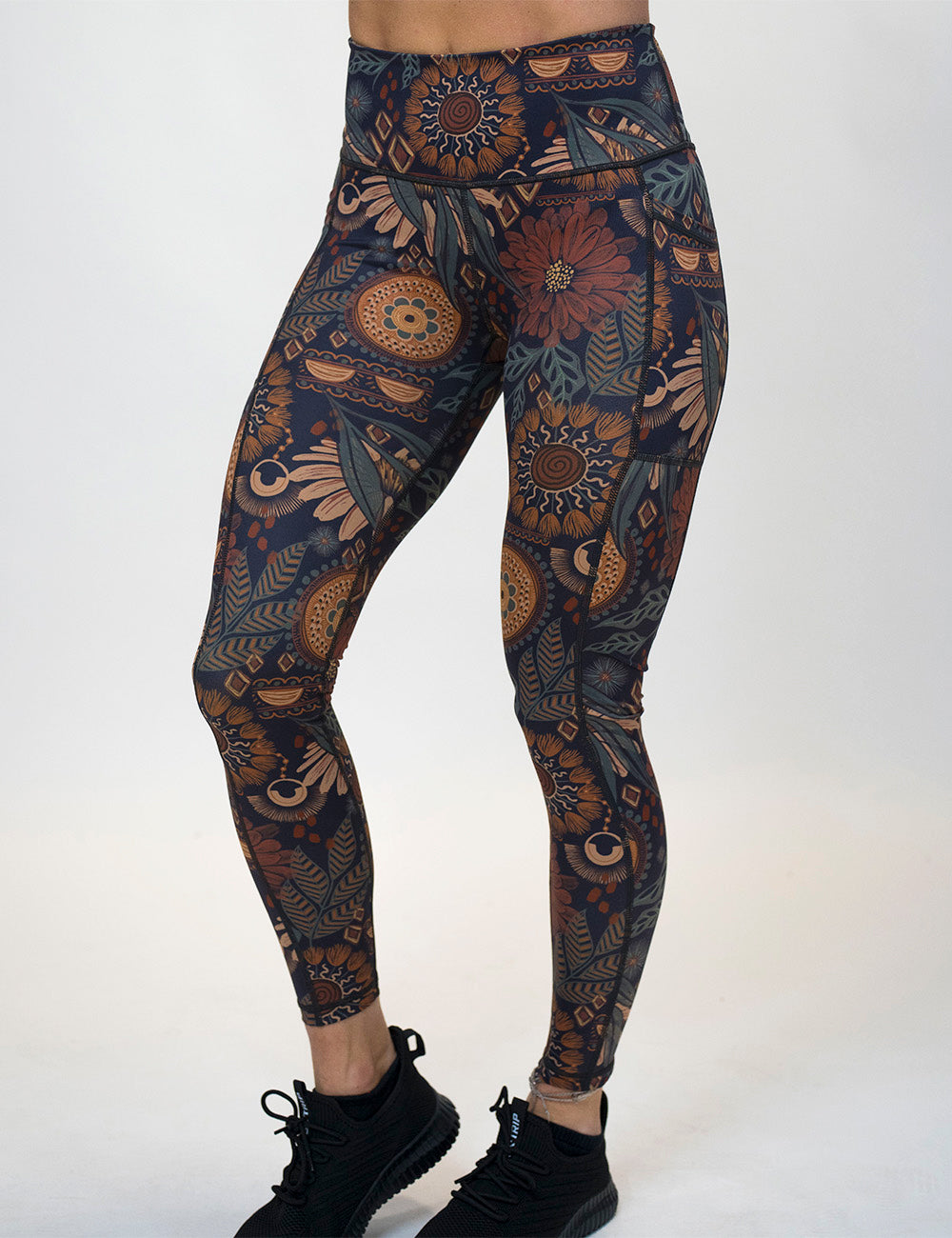 front of the paisley flowers full length leggings against a white background