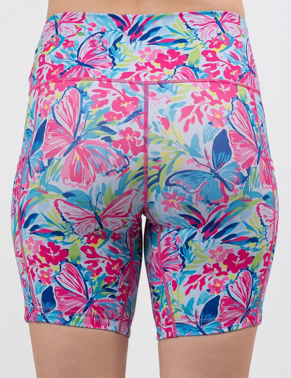 back of the pink butterflies against a colorful floral background 7 inch shorts