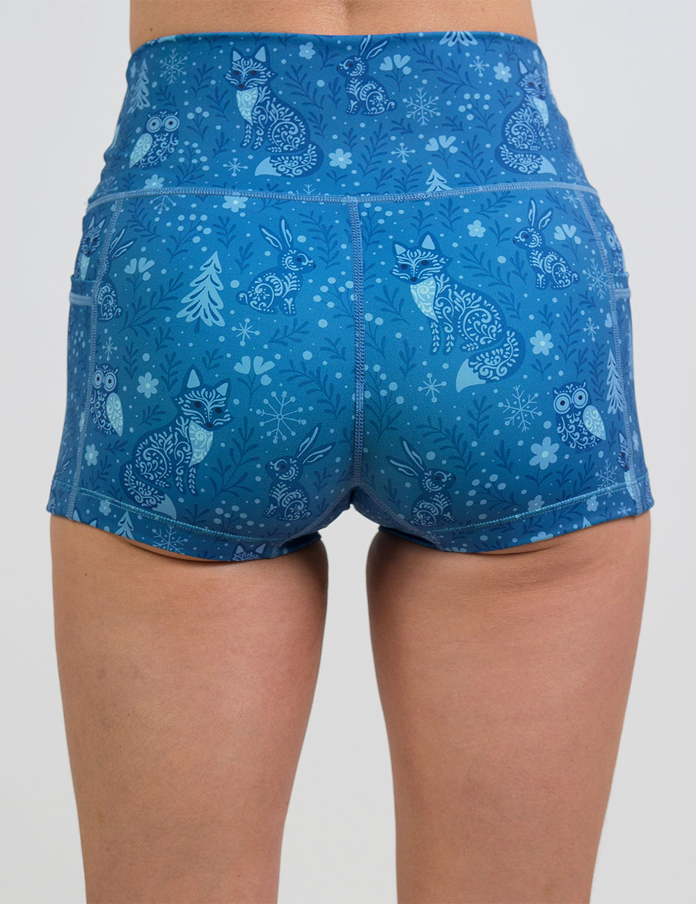 back of the 2.5 inch blue foxes, owls, and bunnies in a winter landscape shorts against a white background