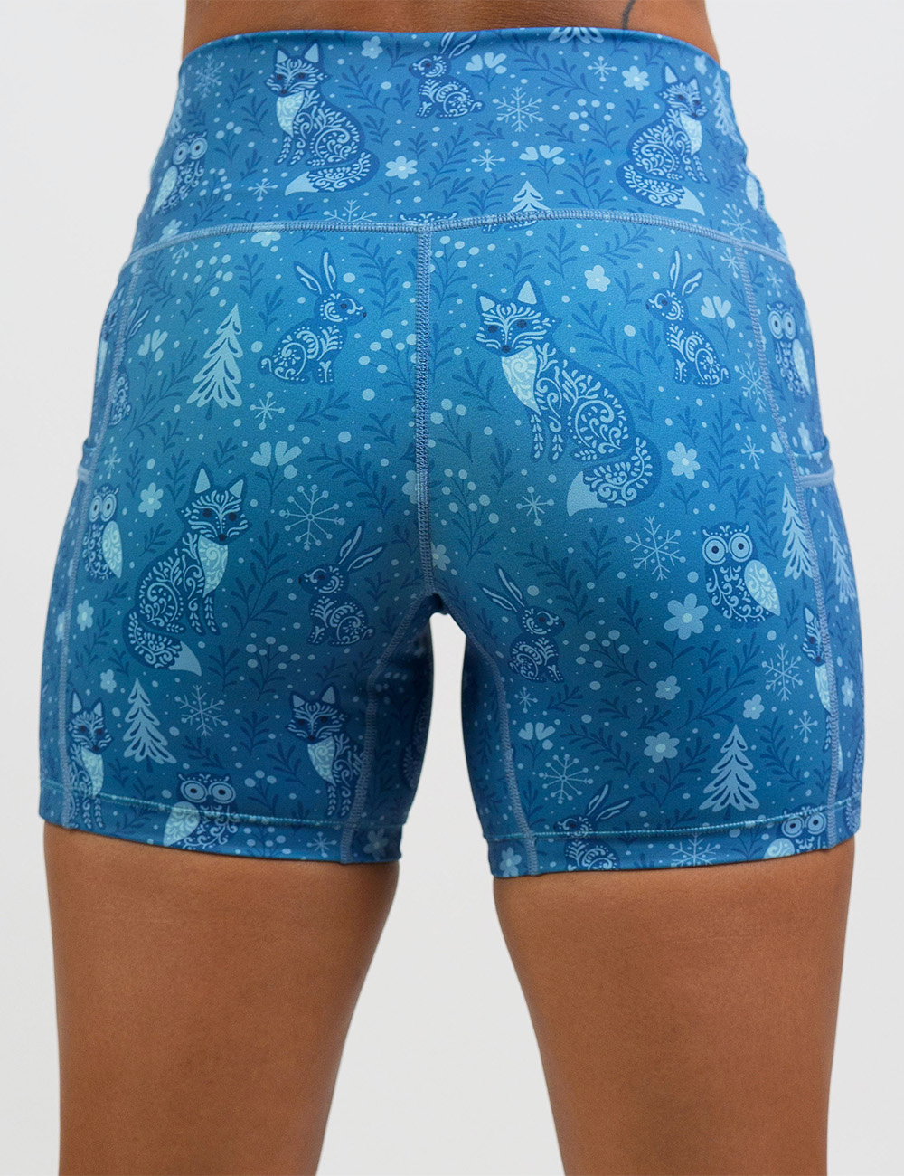 back of the 5 inch blue foxes, owls, and bunnies in a winter landscape shorts against a white background