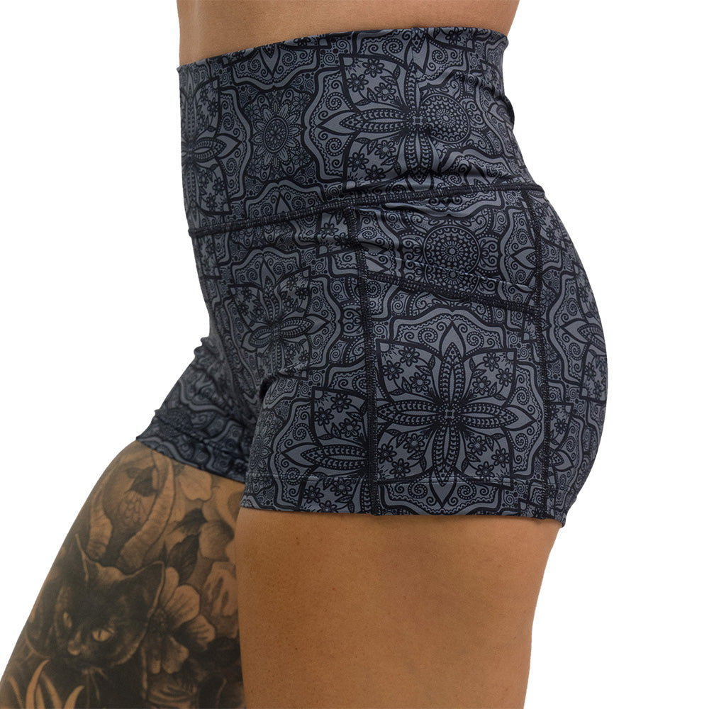 black mandala pattern 2.5 inch shorts facing the side against a white background