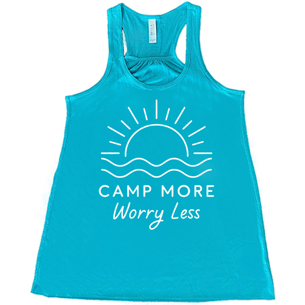 teal flowy tank with the words "camp more worry less" on it, under the line art graphic of a large sun over water