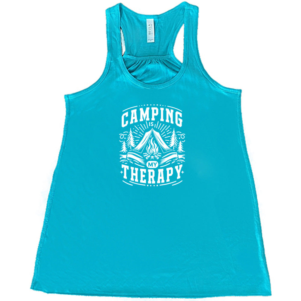 Teal colored flowy tank with a campfire graphic on it that says "Camping Is My Therapy"