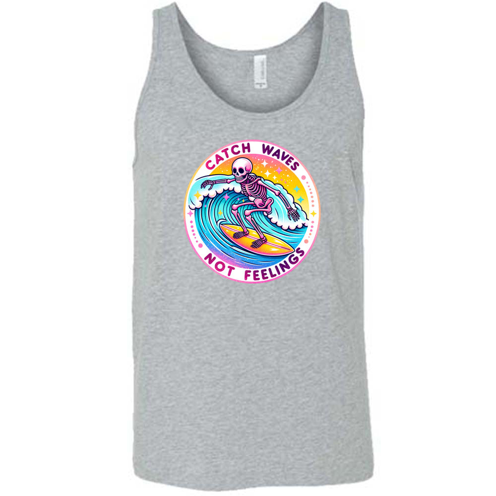 Grey colored tank with a skeleton surfing graphic on it that says "Catch Waves Not Feelings"
